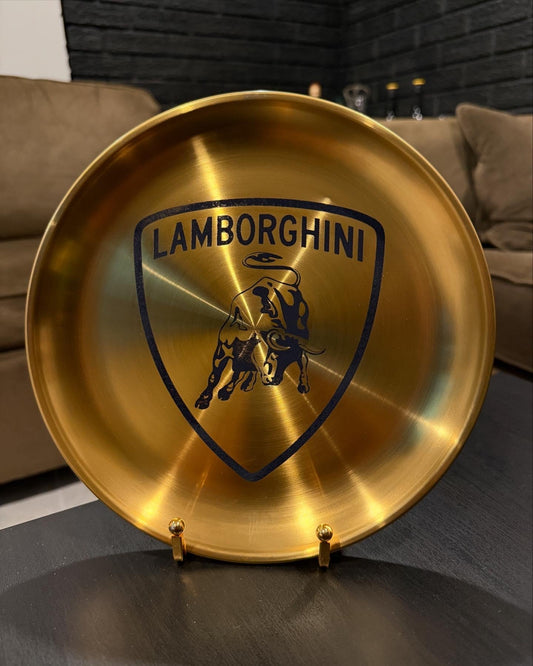 Gold decorative plate featuring a prancing horse emblem and bold engraved shield design, inspired by iconic automotive style.