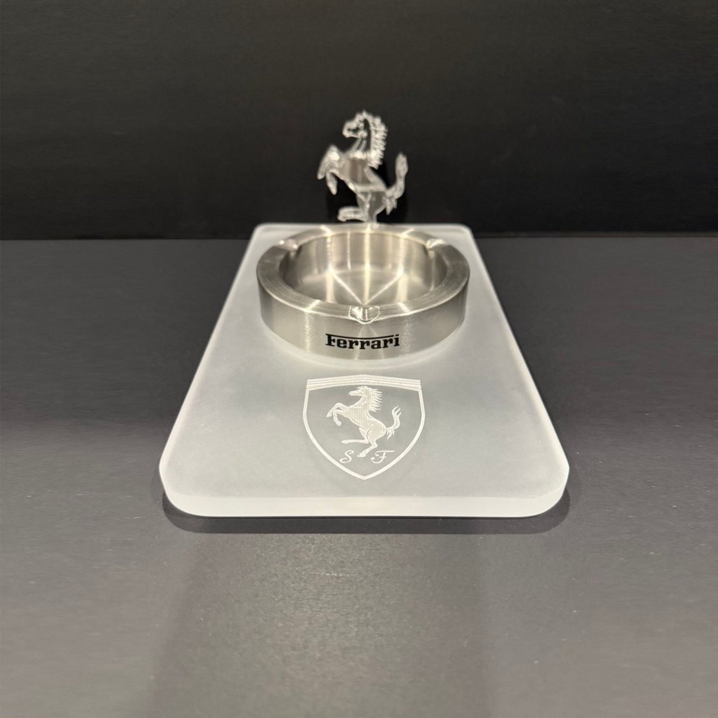 Top view of an all-acrylic Ferrari-inspired ashtray with an engraved shield and a standing 3D horse detail.