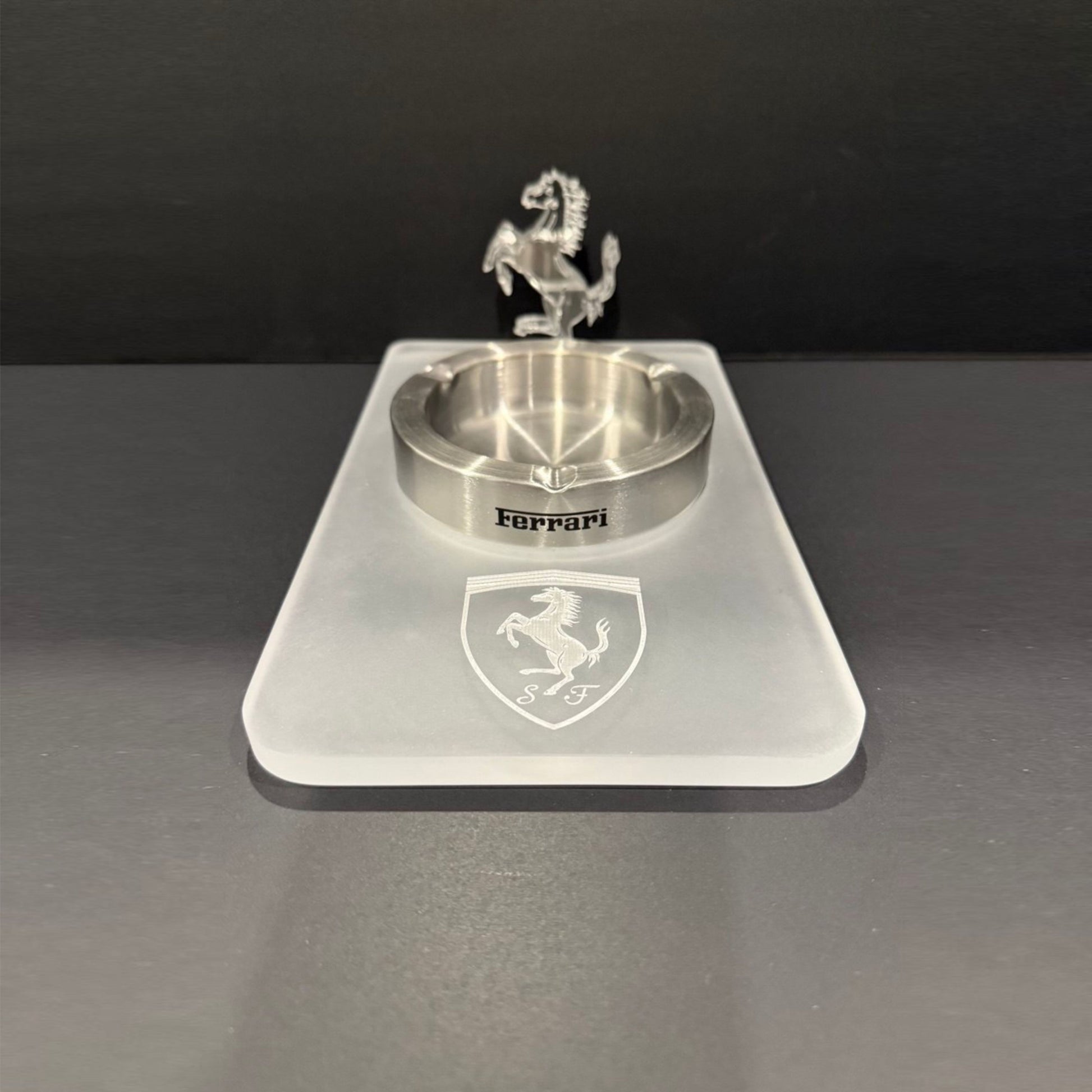 Top view of an all-acrylic Ferrari-inspired ashtray with an engraved shield and a standing 3D horse detail.