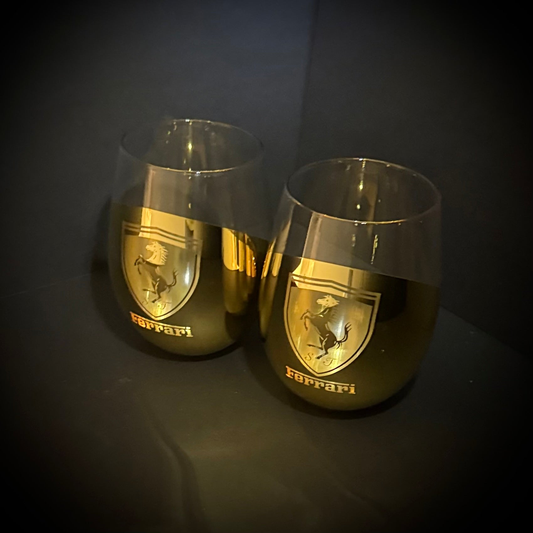 Two Ferrari-branded wine glasses