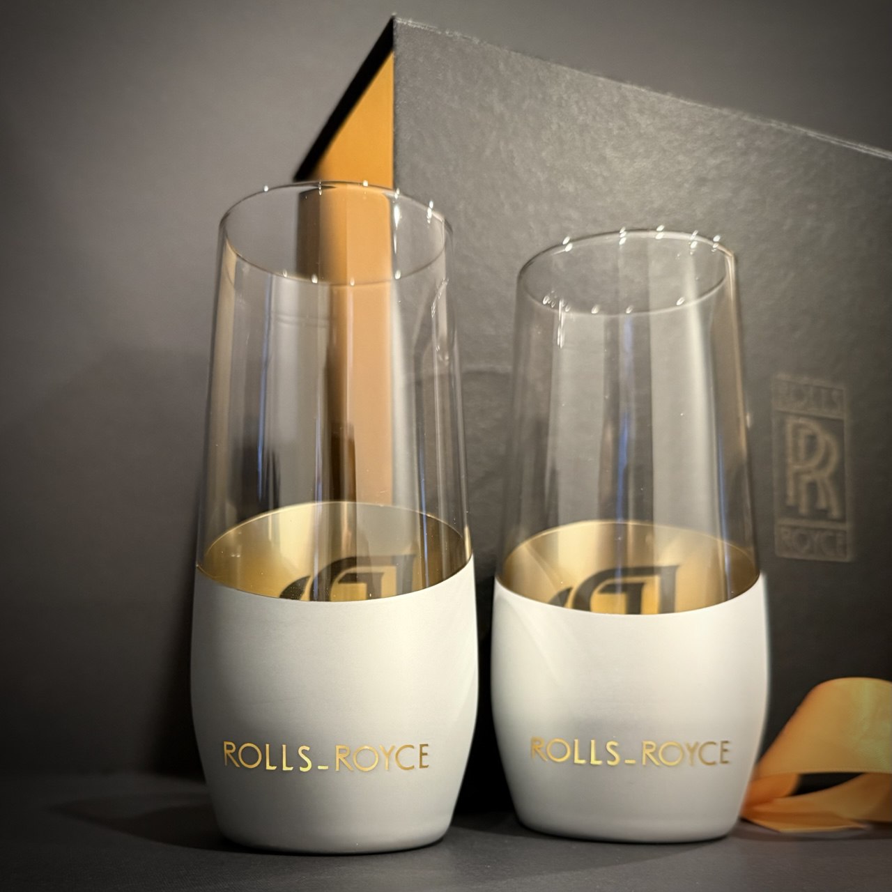 Silver matte spirit-inspired glasses with gold interior shown in a premium display