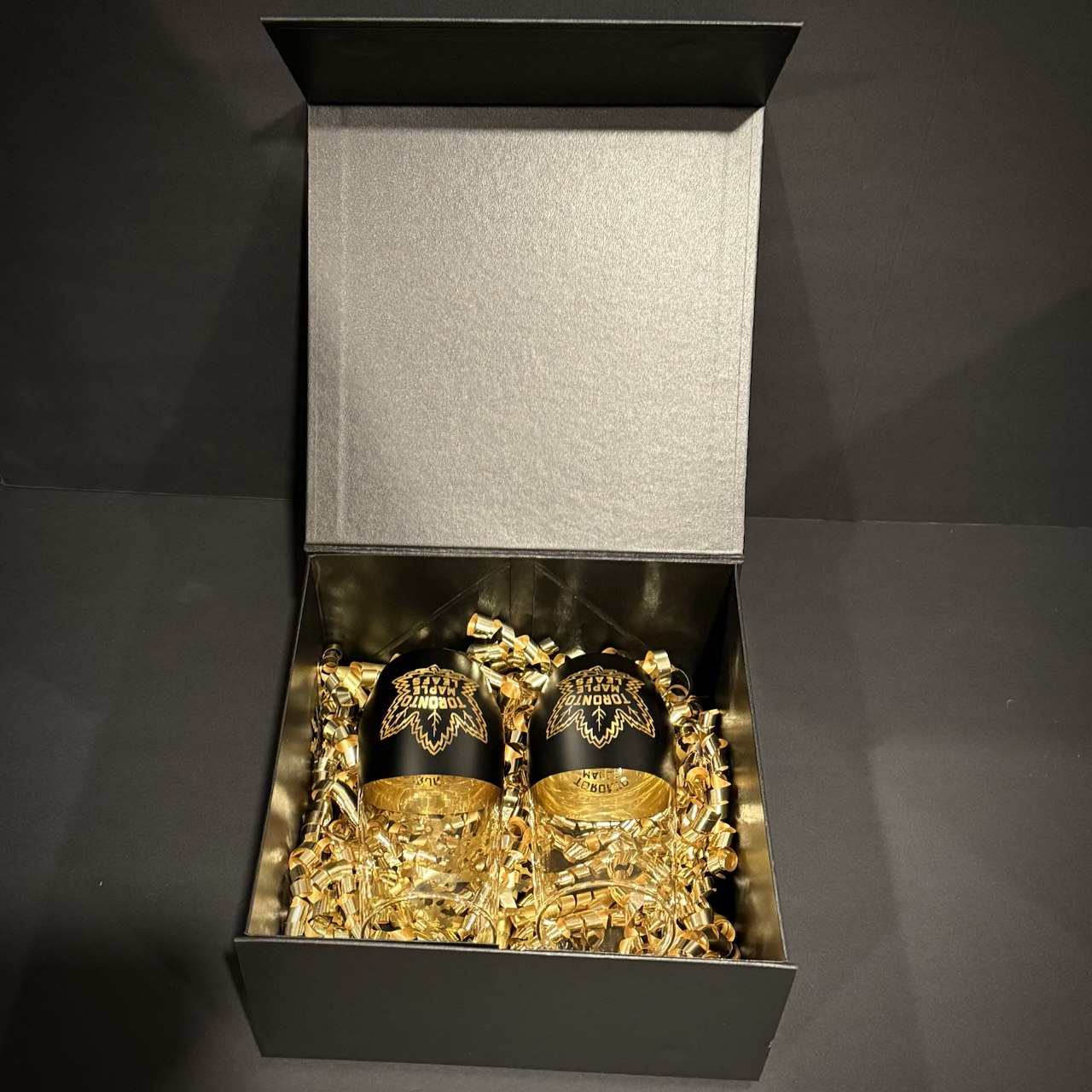 Premium black collector gift box with gold decorative filler for luxury glass set